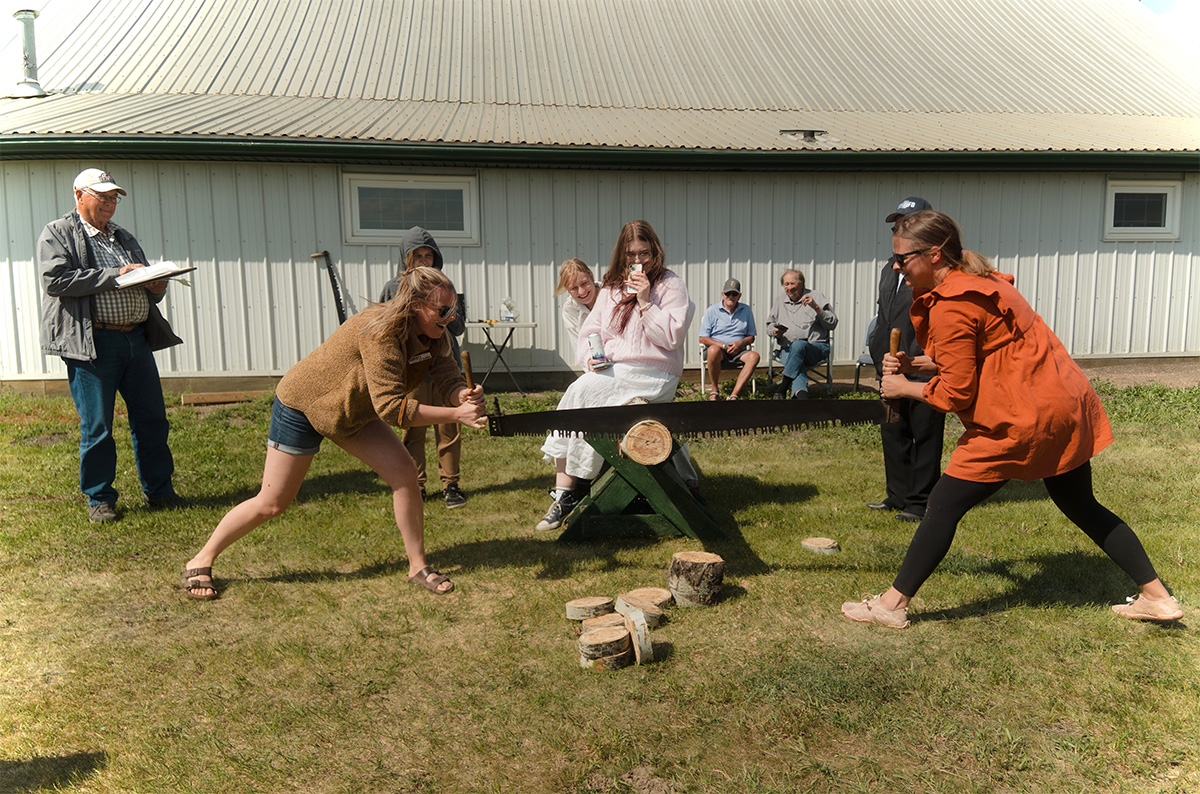 The Ojamaa sisters-laugh their way through the log sawing competition